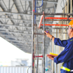 Certified scaffolders working with safety equipment on construction and industrial sites in UAE